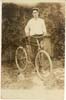Man on early bicycle